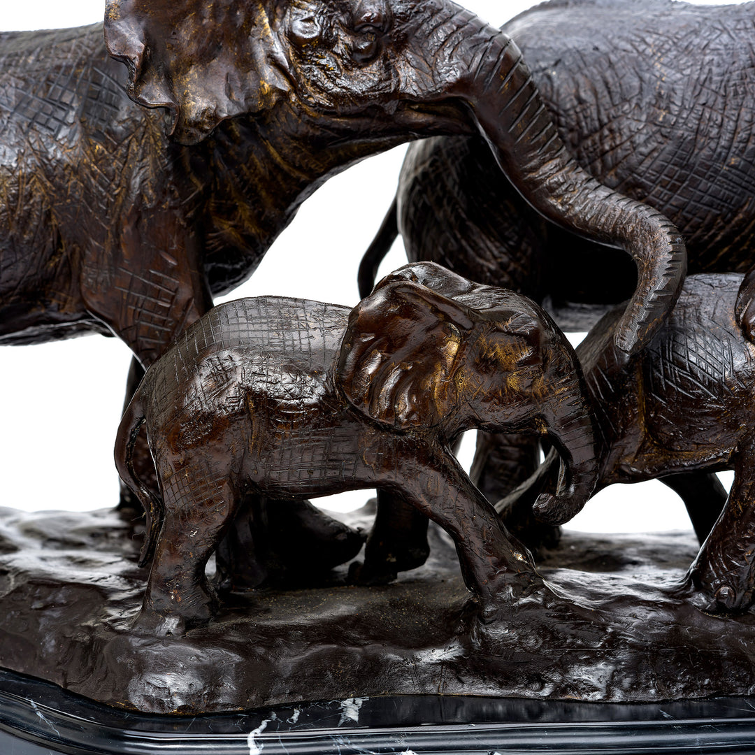 Detailed bronze elephants with textured skin and expressive faces.