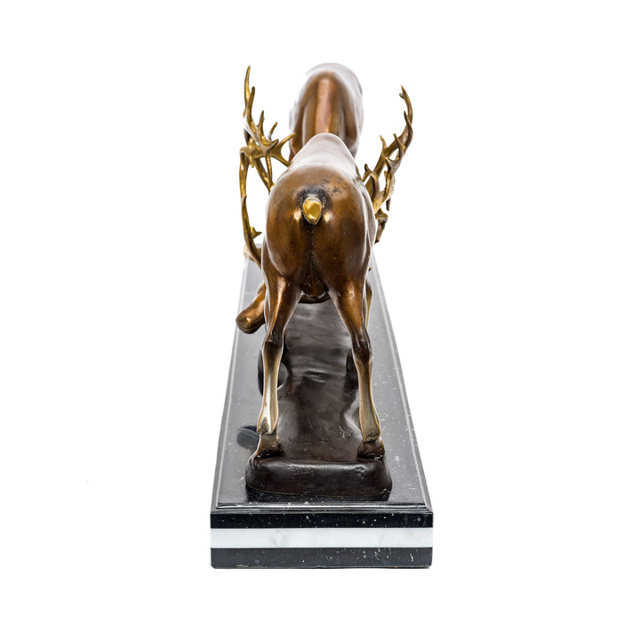 Artistic bronze fighting deer figurine with rich patina.