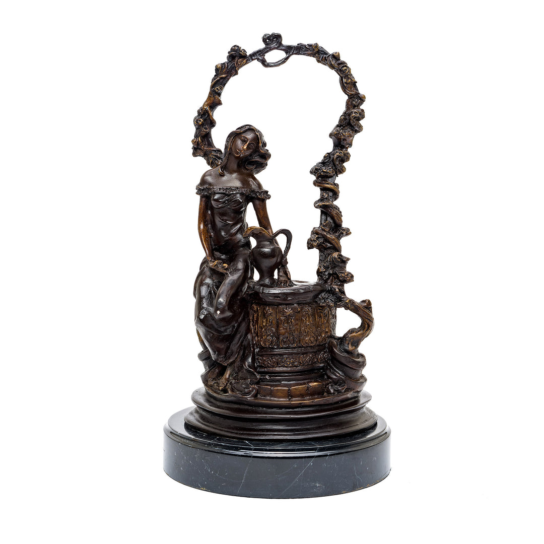 Charming bronze wishing well sculpture with rich finish.