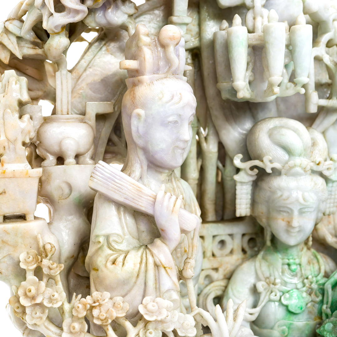 Close-up of detailed figures in jade statue