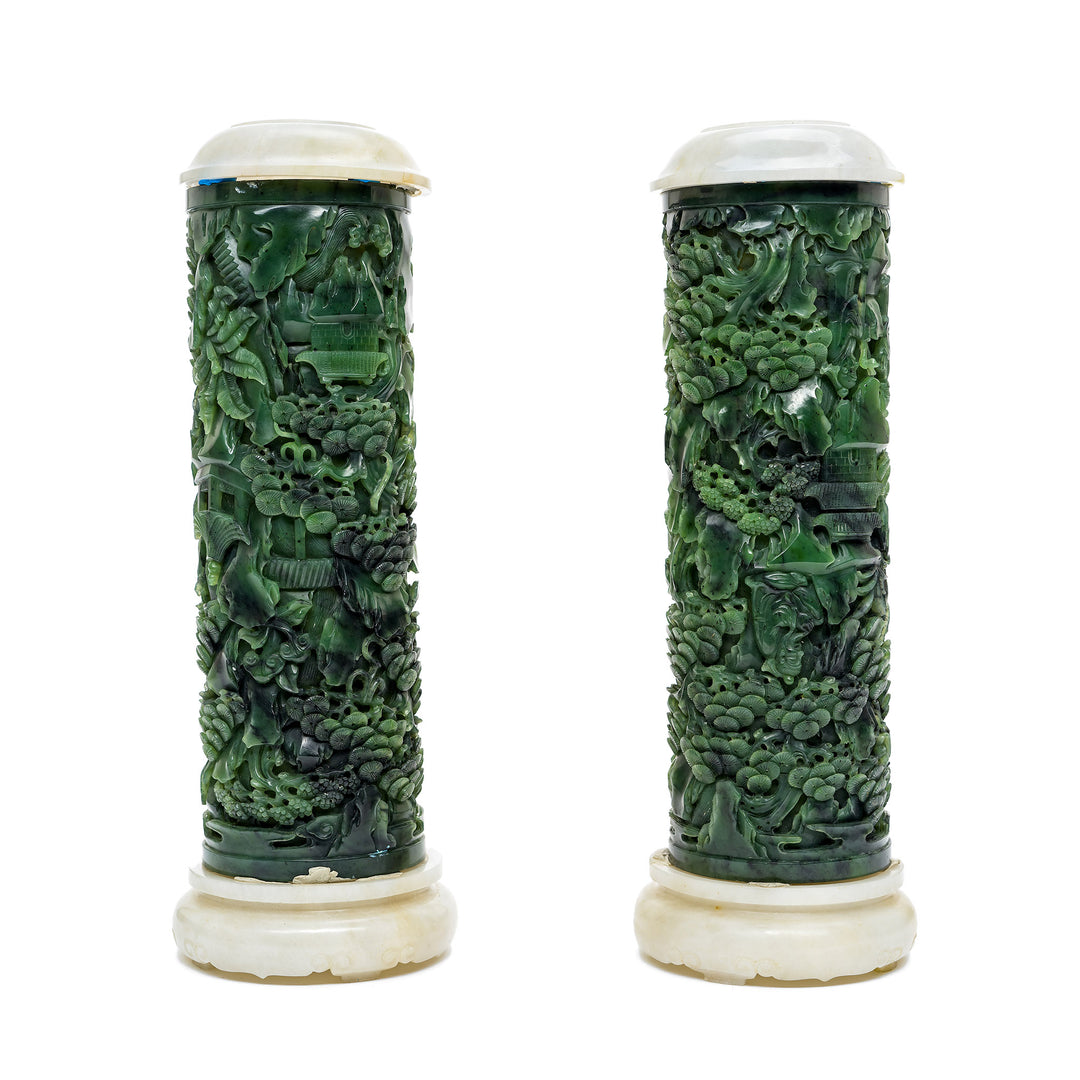 Intricate sculptural elements on jade cylinders