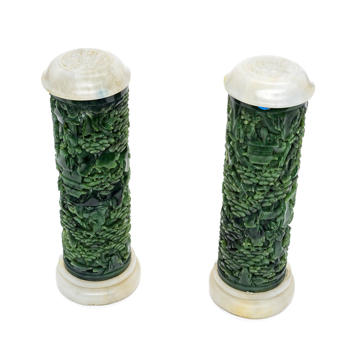 Rich green jade cylinders with intricate details