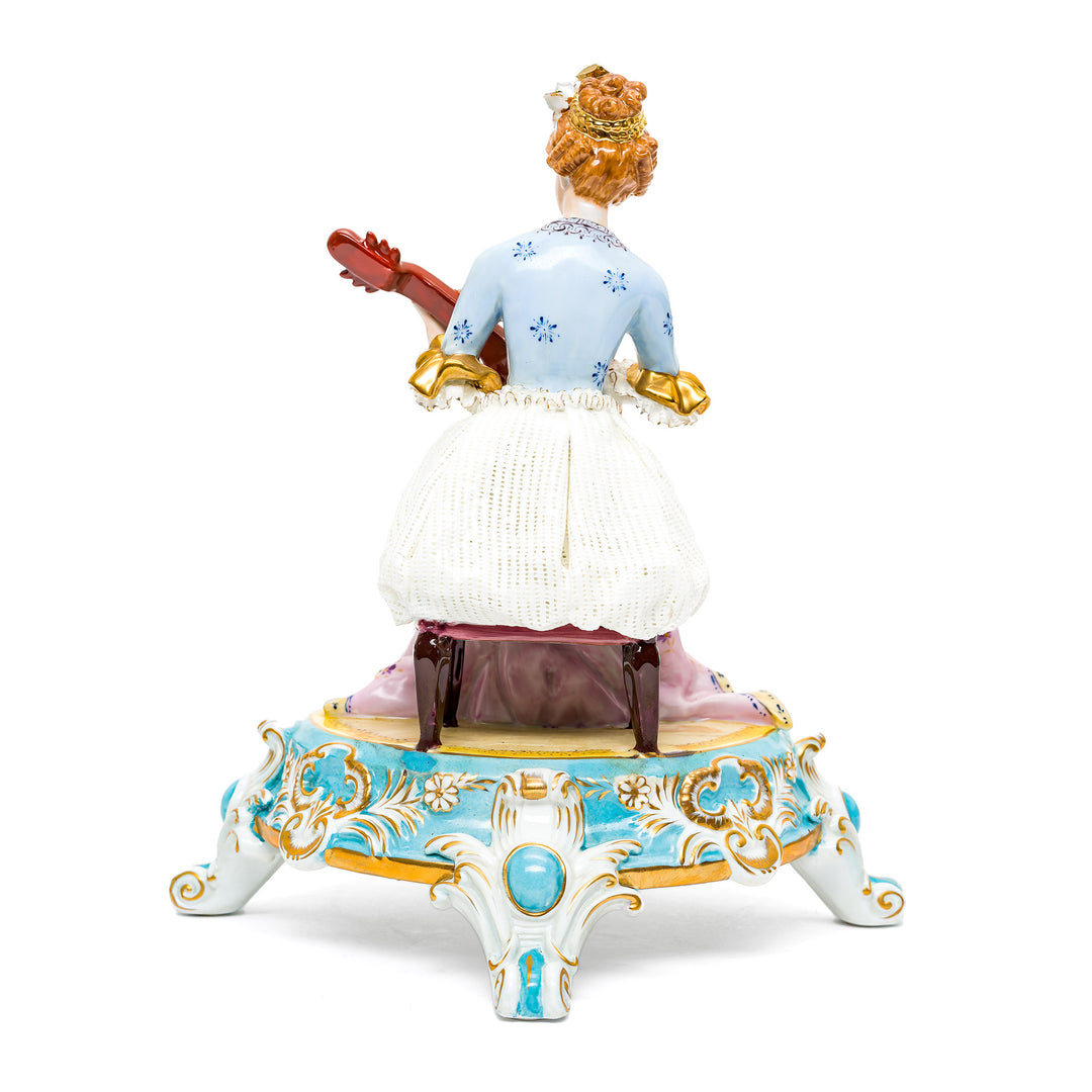 Hand-painted Dresden figurine with intricate floral patterns.