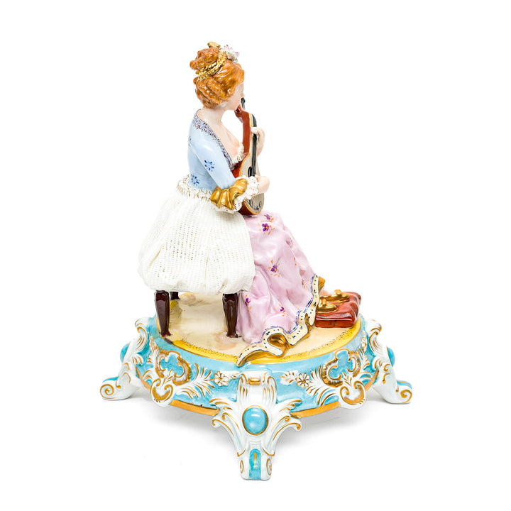 Porcelain musician sculpture showcasing delicate artistry.