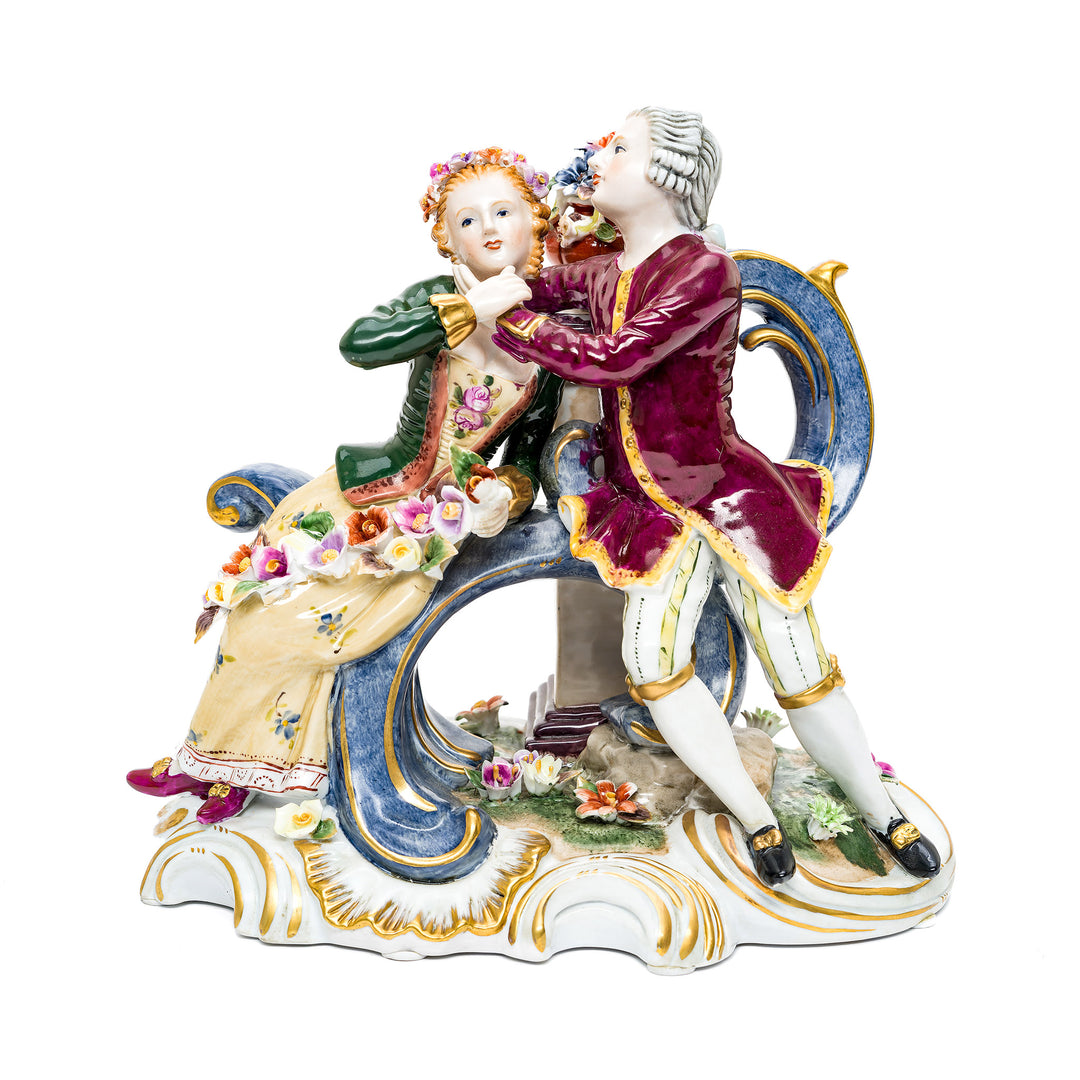 Elegant Dresden porcelain young couple figurine with hand-painted details.