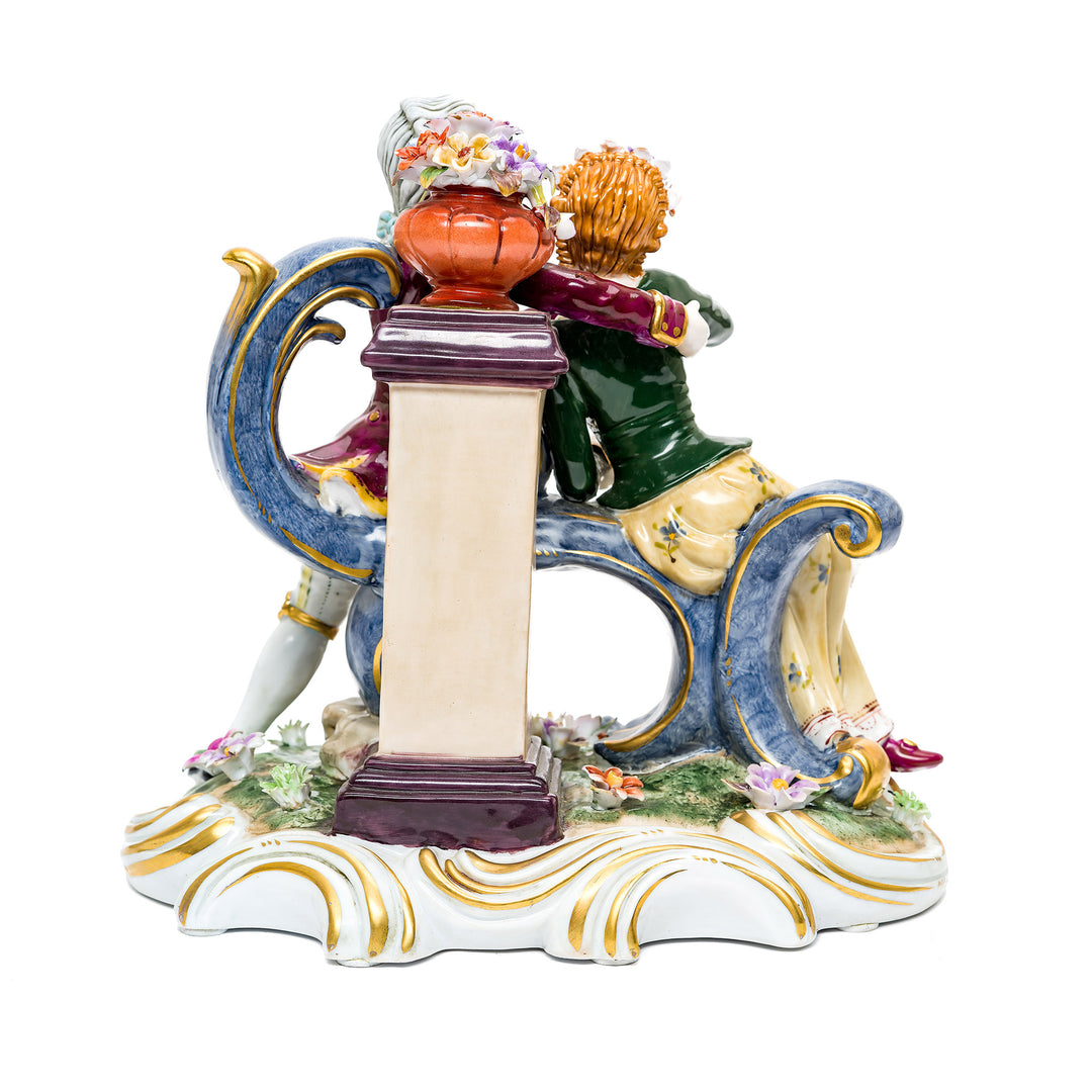 Dresden porcelain art piece depicting a young couple in period attire.