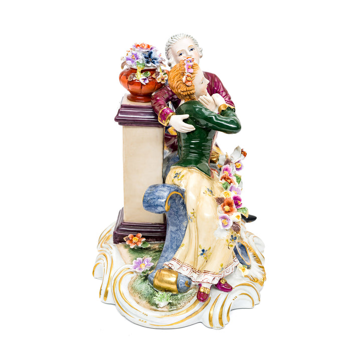 Porcelain couple sculpture showcasing delicate artistry.