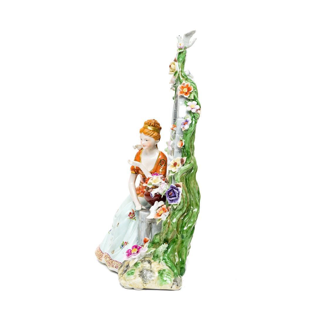 Graceful porcelain lady statue with hand-painted details.