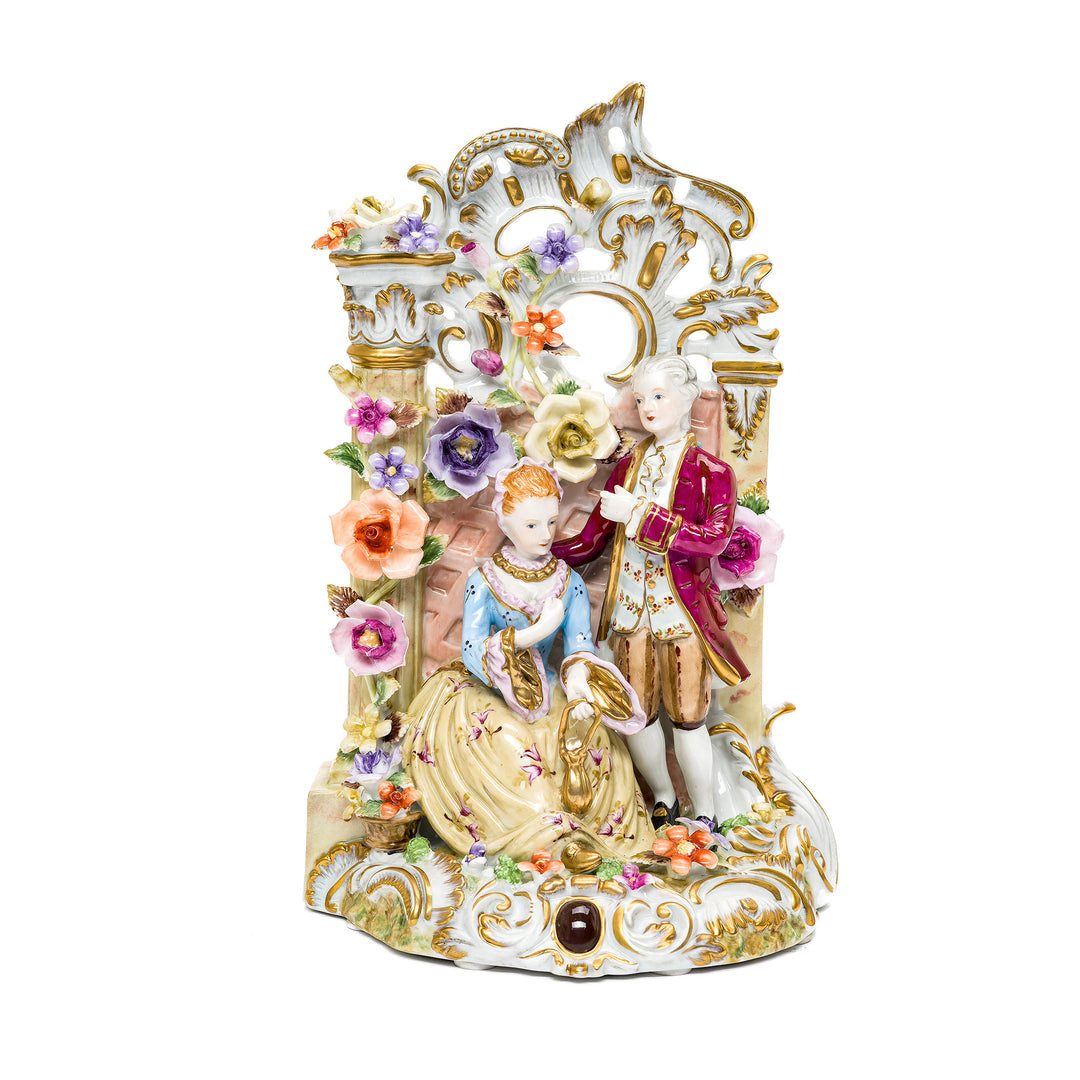 Romantic Dresden porcelain couple figurine with hand-painted details.