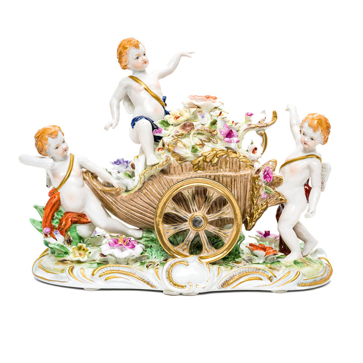 Delightful Dresden porcelain cherubs figurine with hand-painted details.