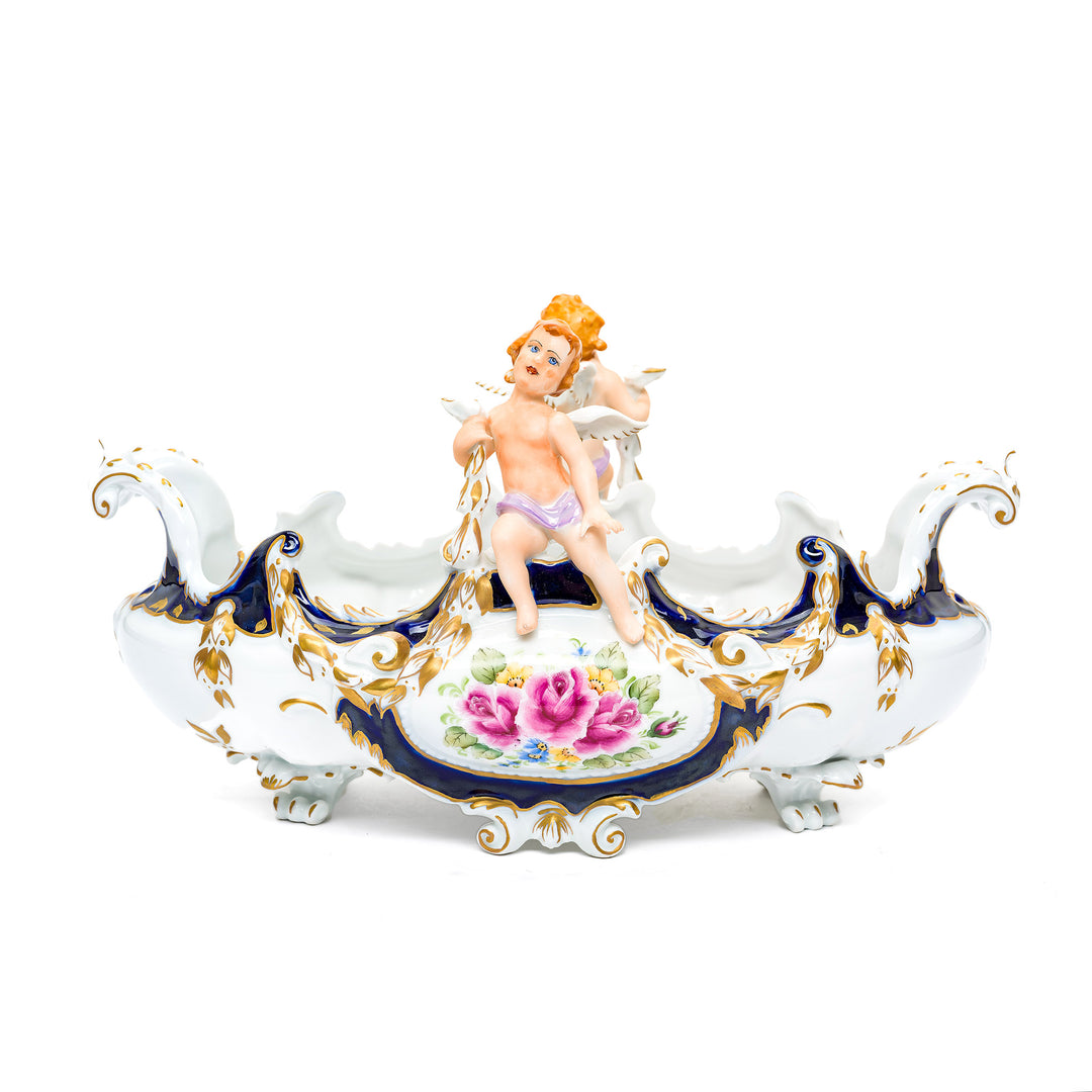 Charming Dresden porcelain cherub bowl with hand-painted details.
