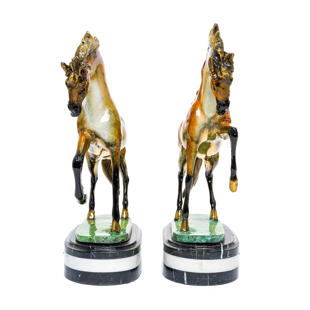 Elegant bronze horse sculptures on marble bases