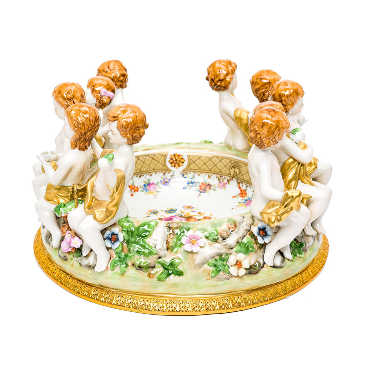 Intricate cherub and floral porcelain centerpiece