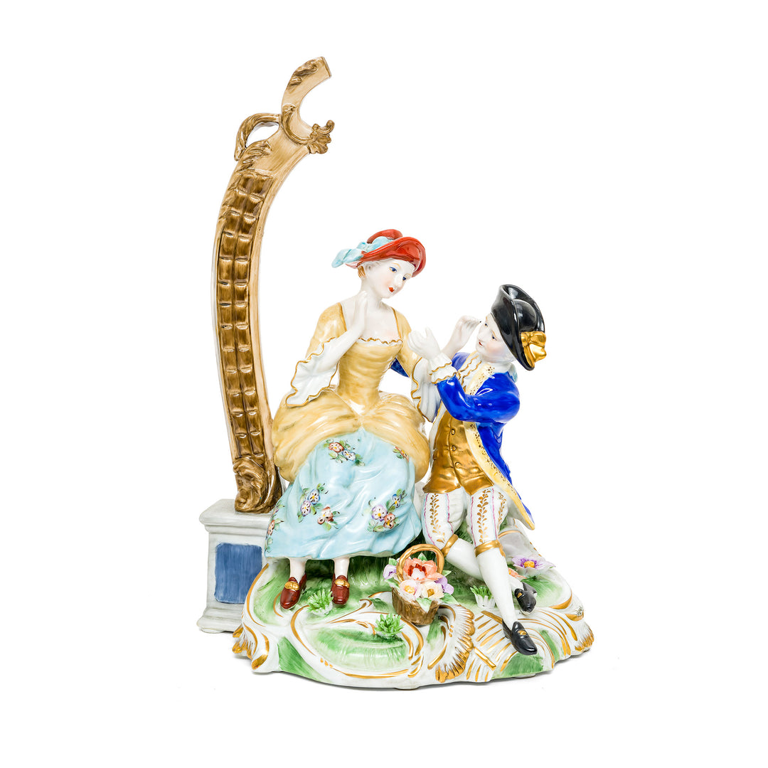 Elegant Dresden Porcelain Couple figurine with hand-painted details.