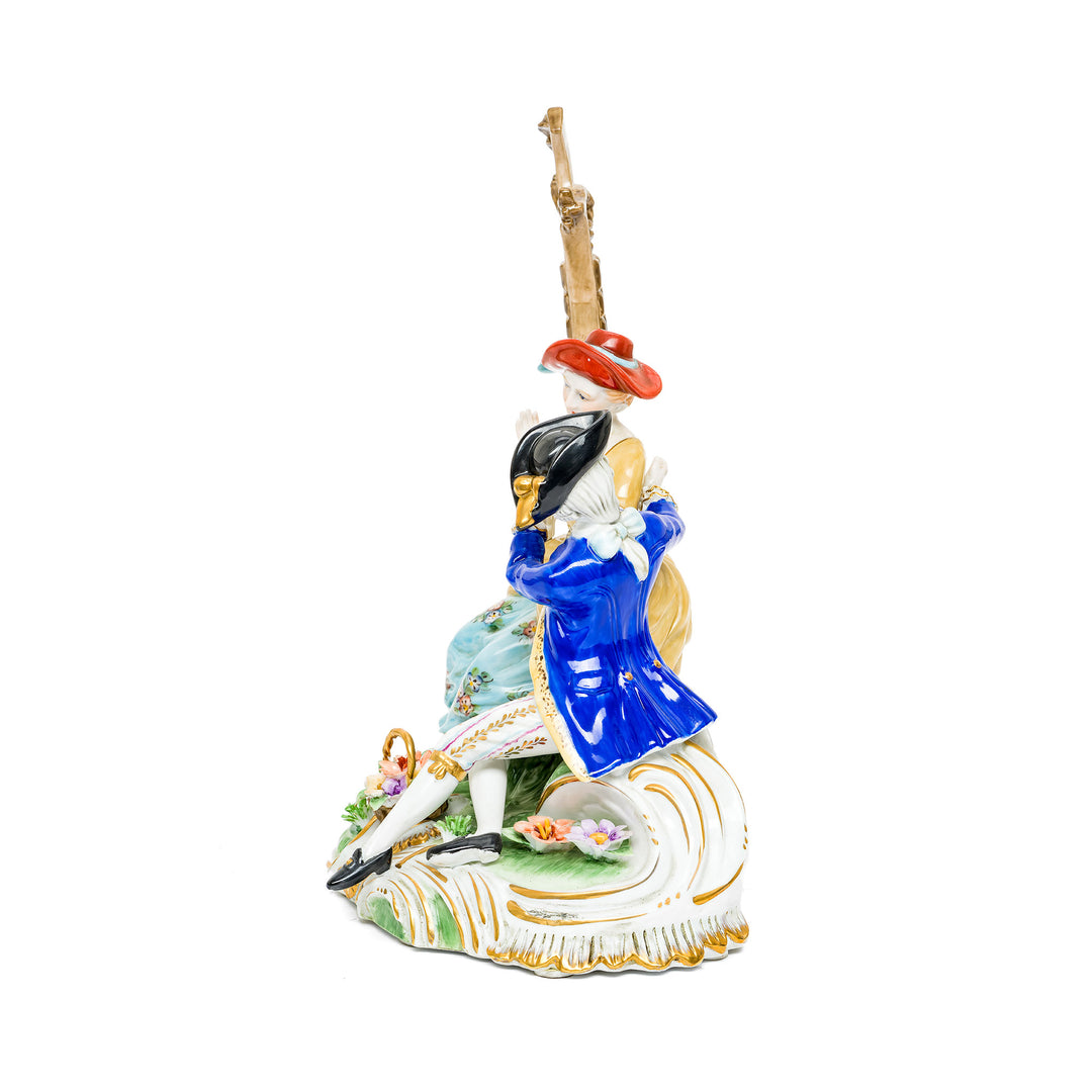 German porcelain figurine depicting a romantic courtship scene.