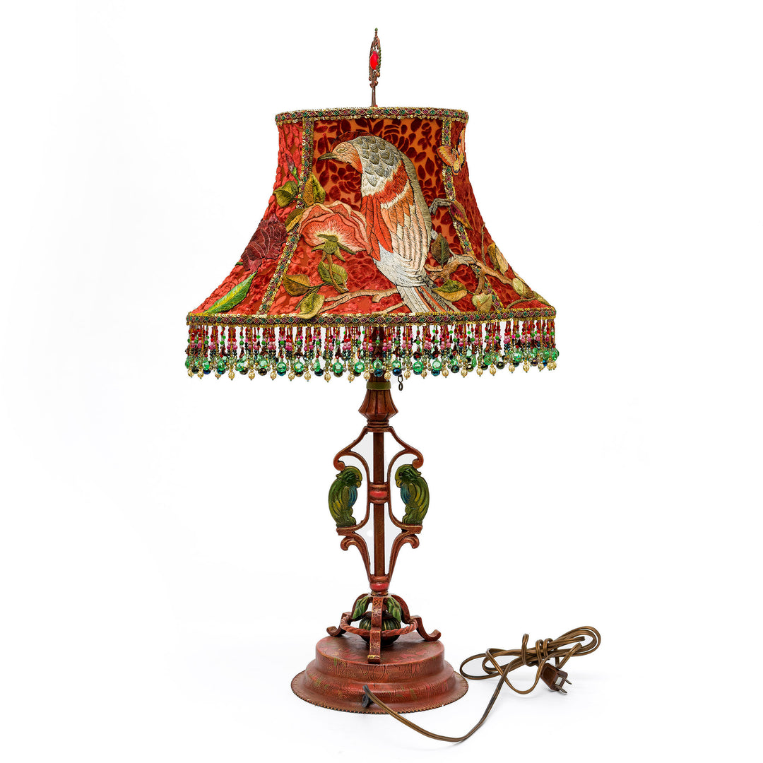 Decorative table lamp with a colorful lampshade on a white background