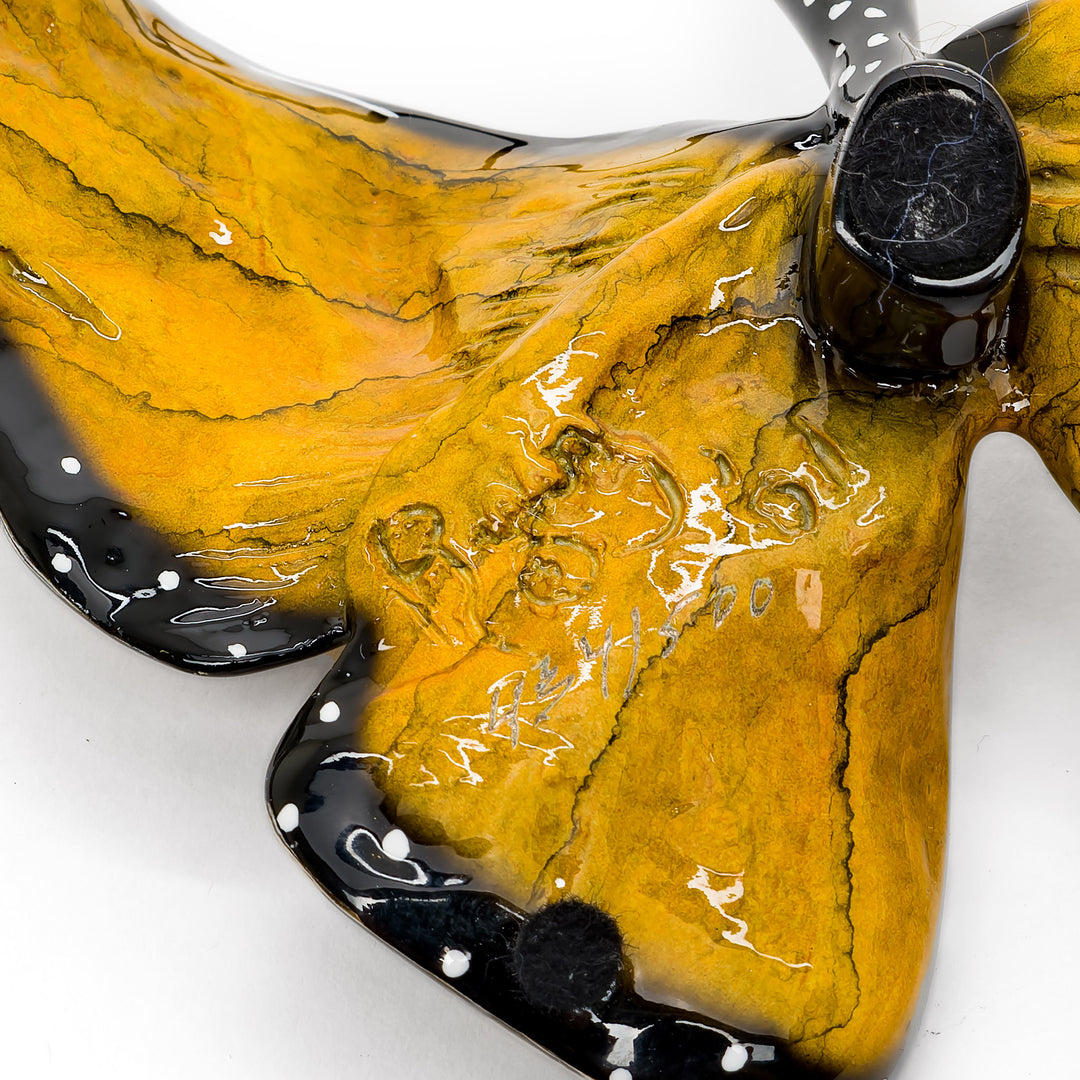 Back view of Ruiz butterfly sculpture with signature details