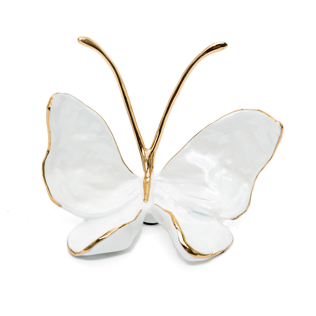 Pearl white butterfly sculpture with gold trim and bronze antennae