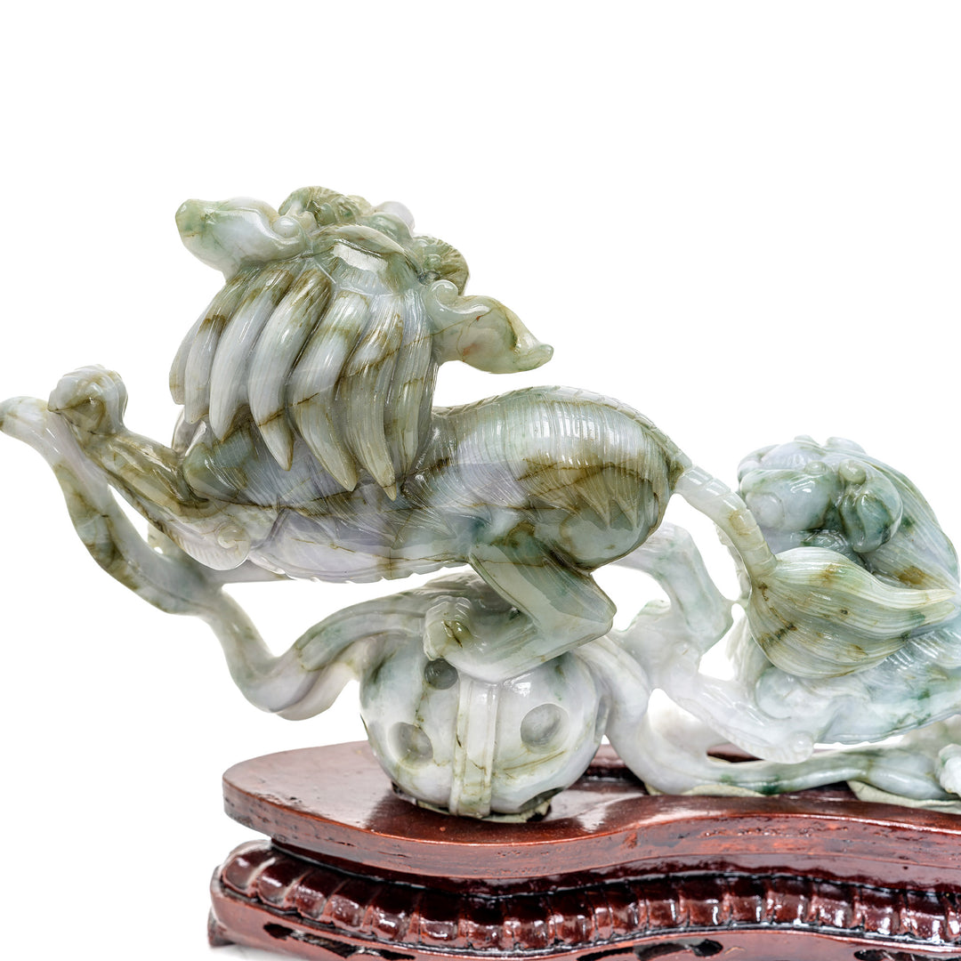 Two jade Foo Lions poised in eternal vigilance, a masterpiece of traditional art