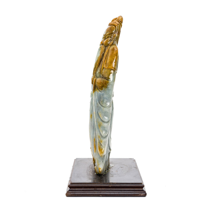 Detailed jade Kwan Yu figurine on a wooden base