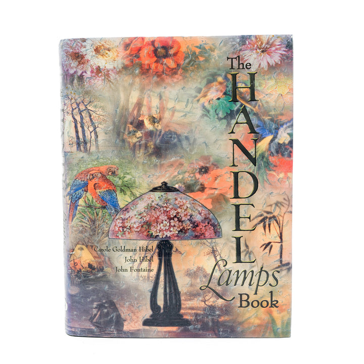 Book cover of 'The Handel Lamps Book' with a colorful design featuring lamps and nature.