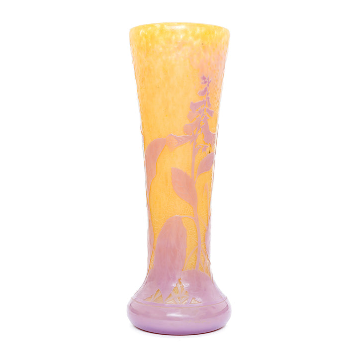 Mottled yellow martele finish vase by Daum with delicate pink flowers.