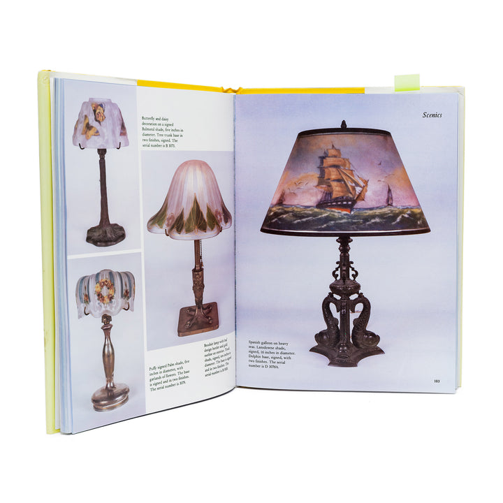 Open book showing illustrations of decorative lamps with a focus on a ship-themed lamp.
