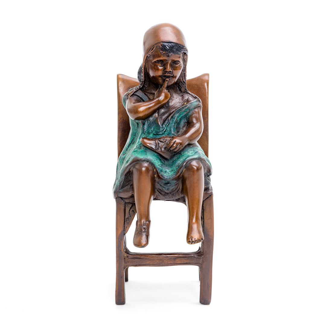 Miniature bronze sculpture of thoughtful young girl.