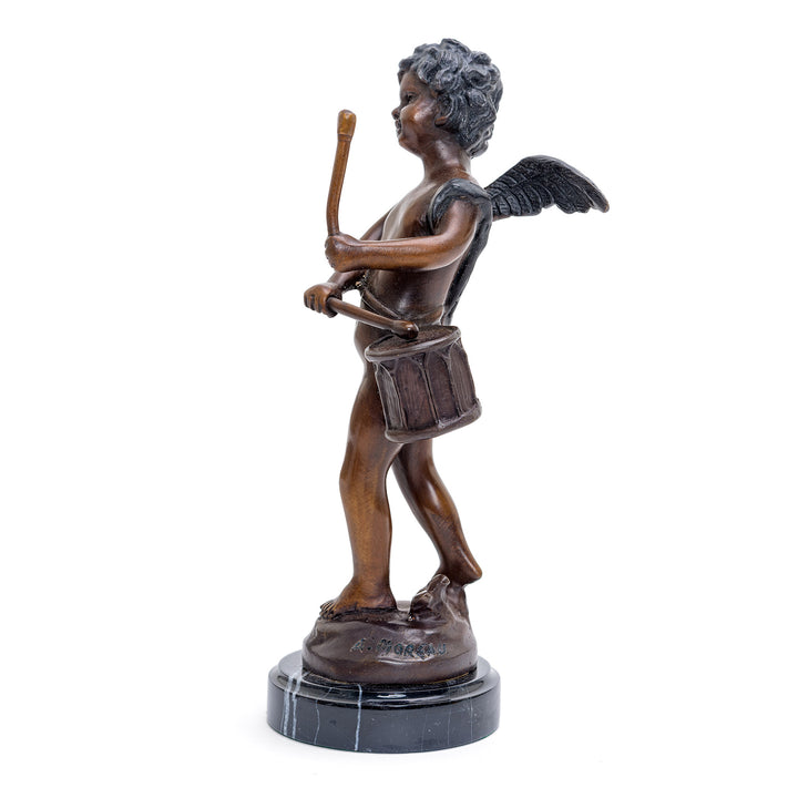 Angelic drummer in bronze, a playful figurine.