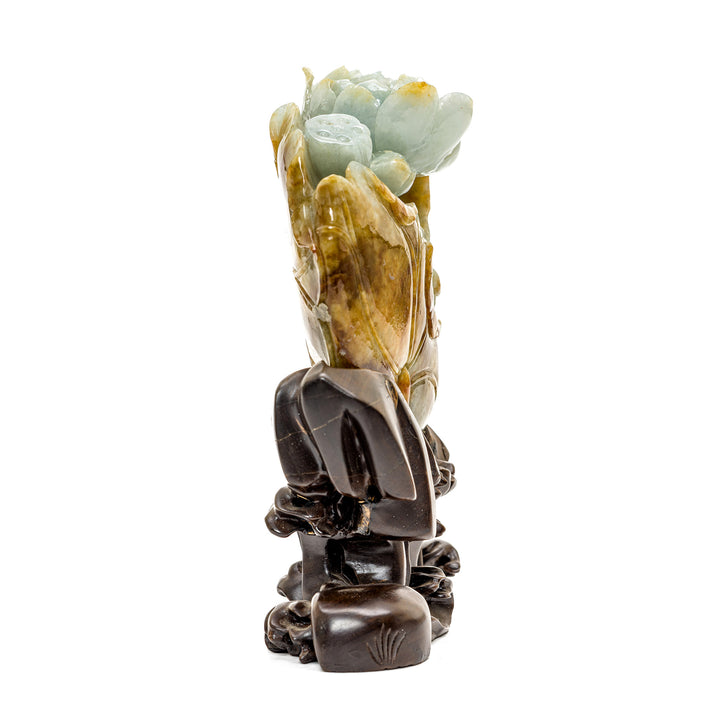 Pale apple and white jade sculpture highlighting a crane in a lotus flower