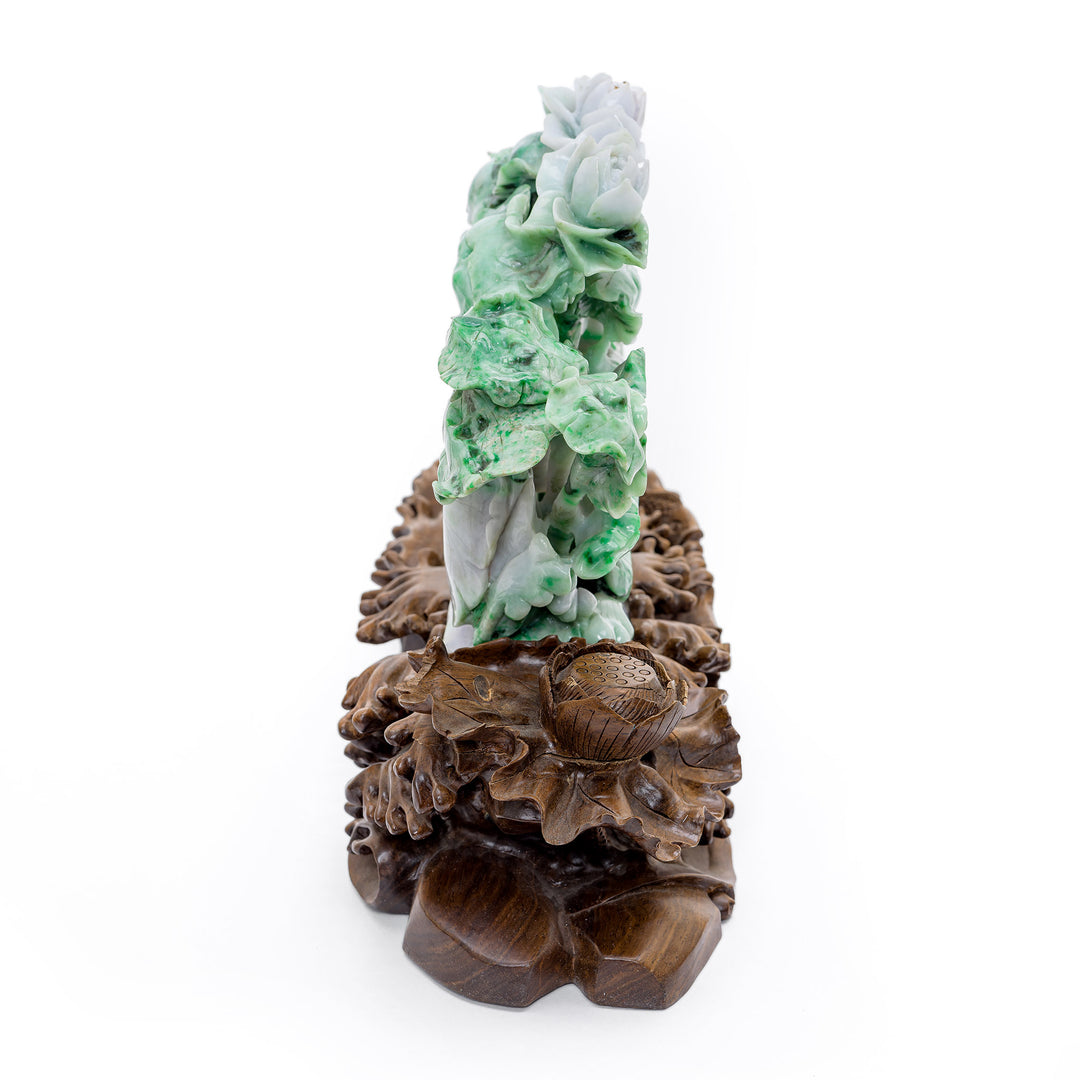 Masterful jade sculpture of a gourd surrounded by lotus flowers and vines