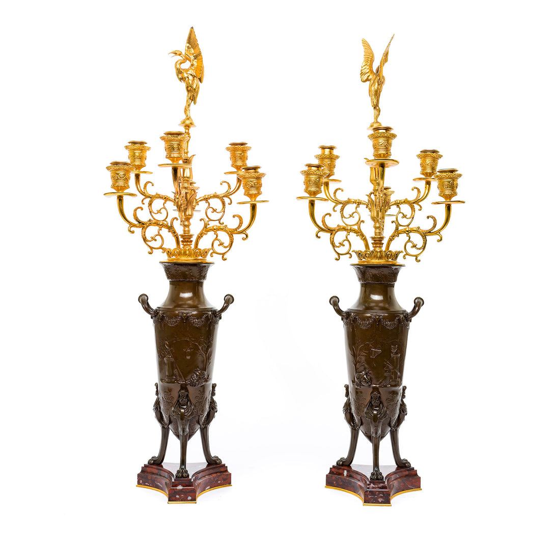 Antique bronze candelabras with ornate gilded arms.