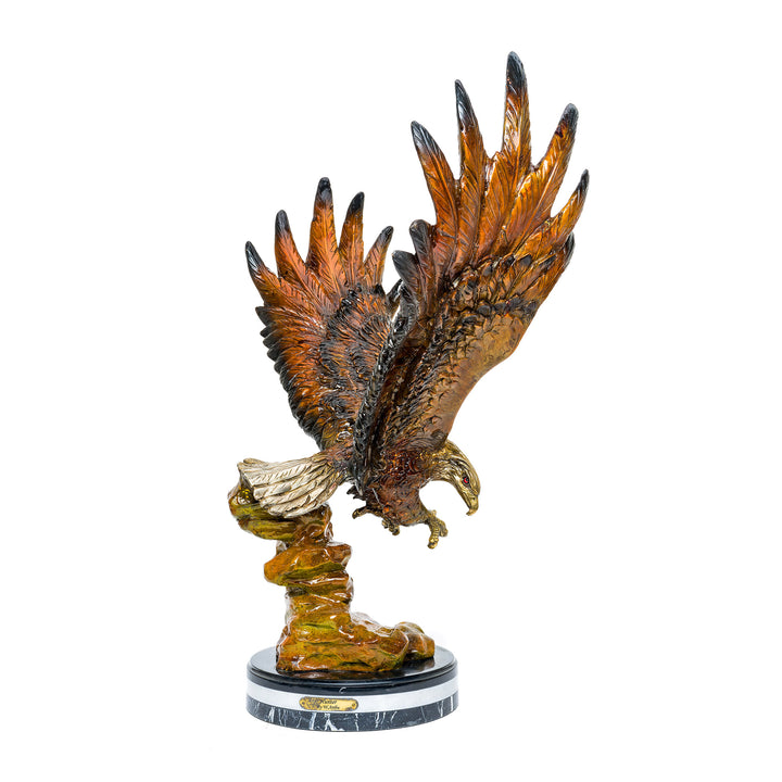 Bronze eagle sculpture with wings outstretched in mid-flight