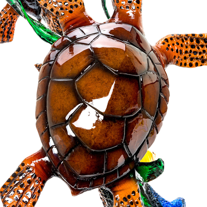 Bronze sea turtle sculpture by Muzika with a vibrant, clear-coated finish.