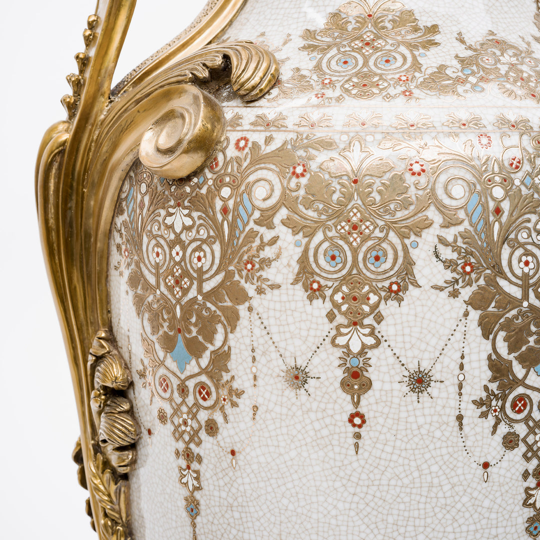 Handcrafted porcelain urns with intricate gold filigree patterns