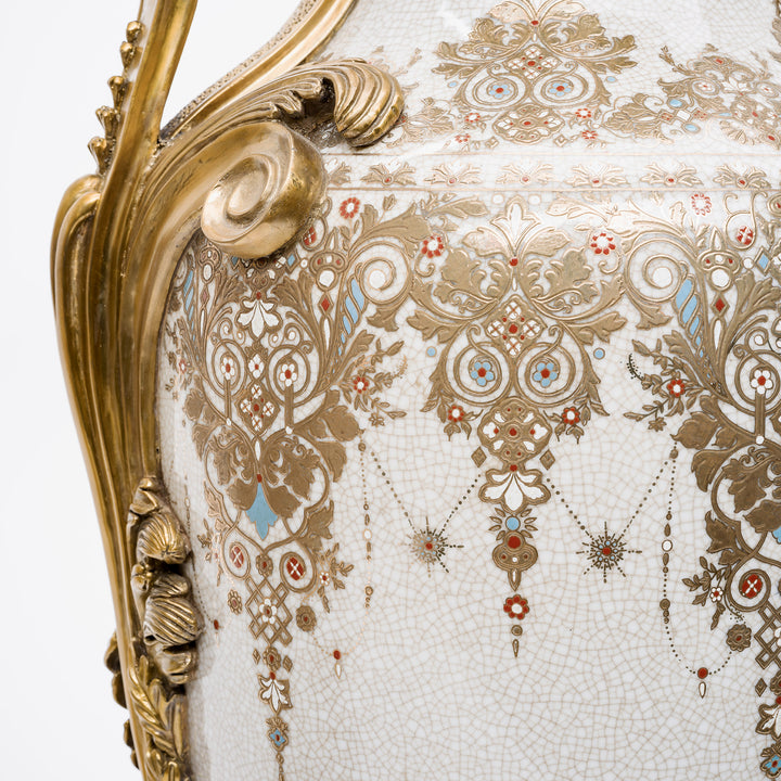 Handcrafted porcelain urns with intricate gold filigree patterns