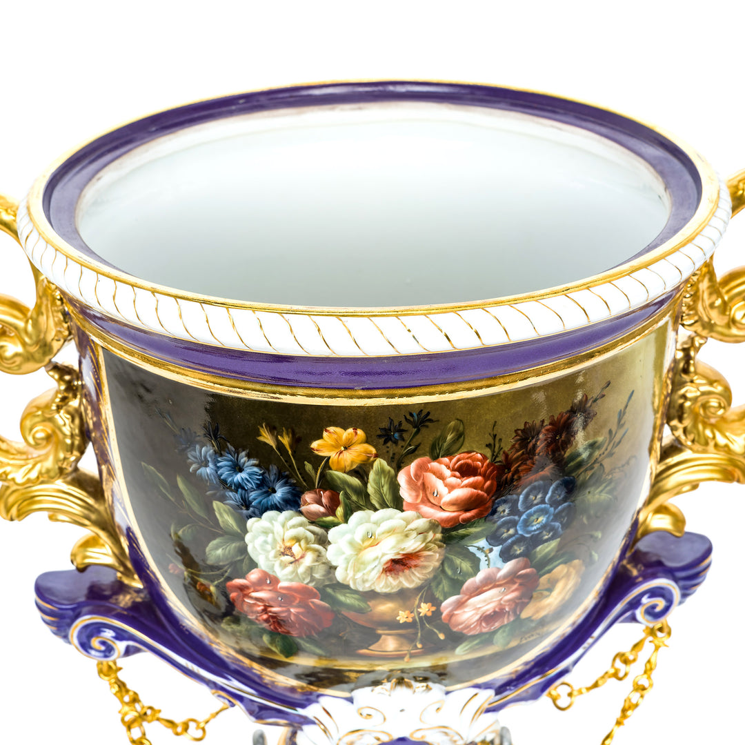 Collectible purple vase with gold trim and floral artwork
