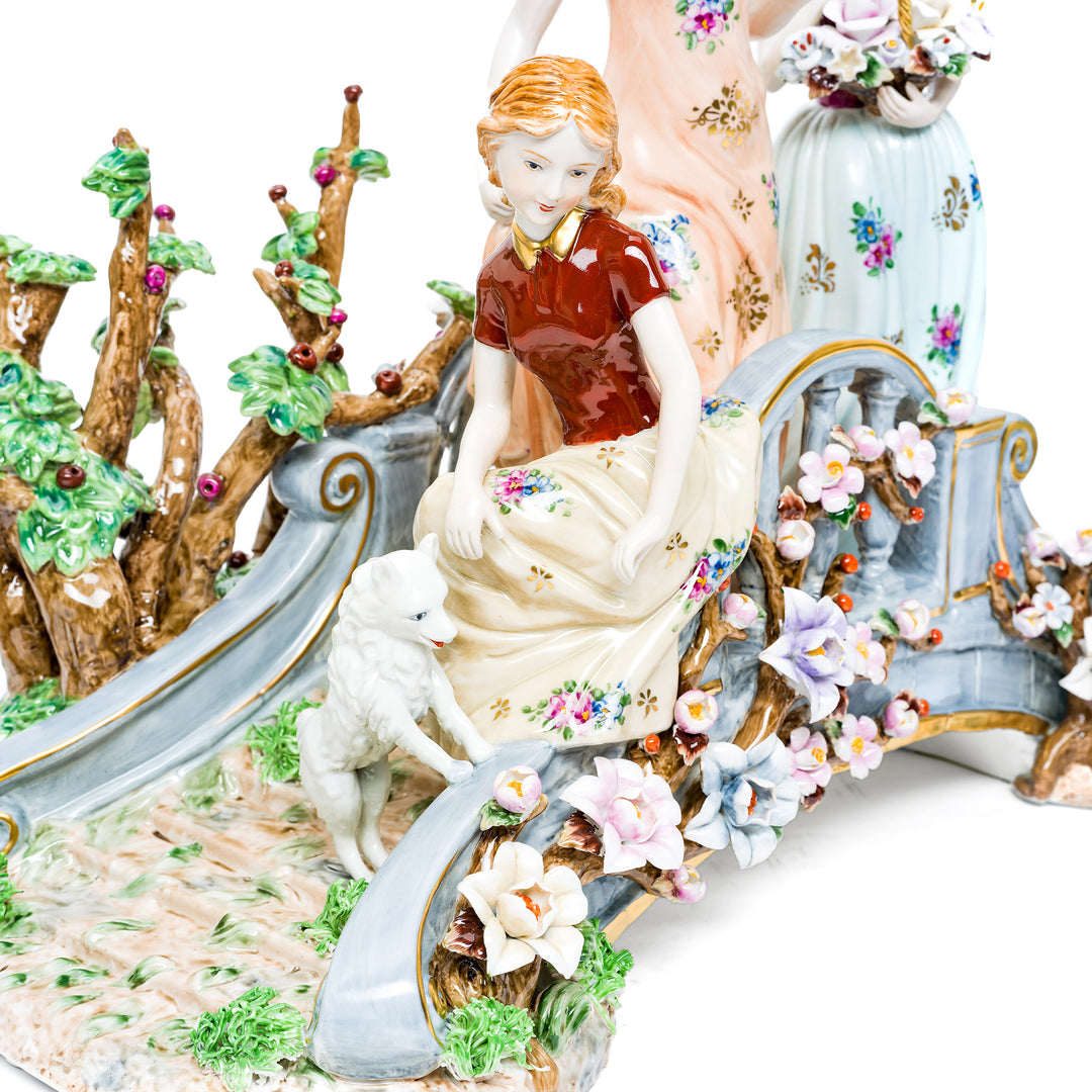Delicate floral designs and soft colors on the Elegant Stroll figurine.
