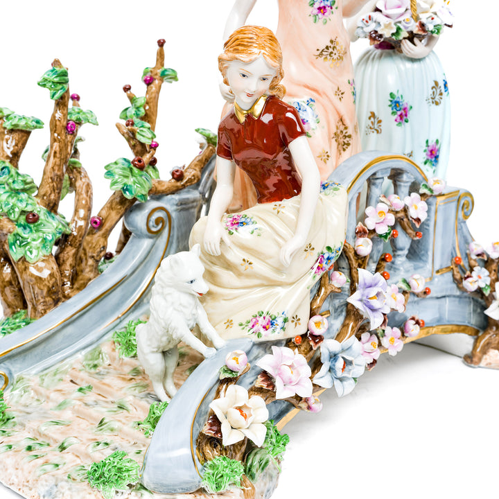 Delicate floral designs and soft colors on the Elegant Stroll figurine.