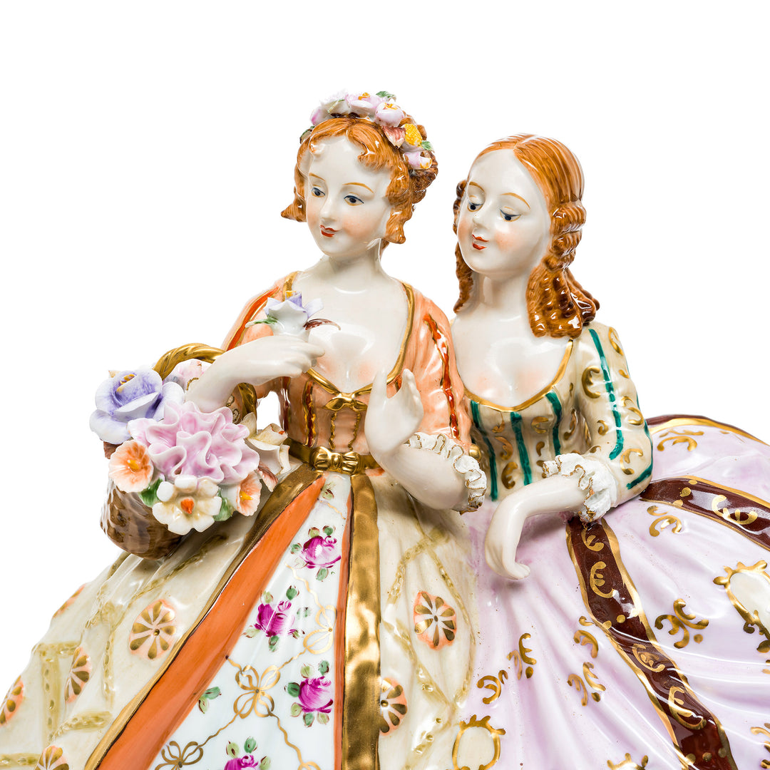 Detailed Dresden porcelain sculpture with gold embellishments.