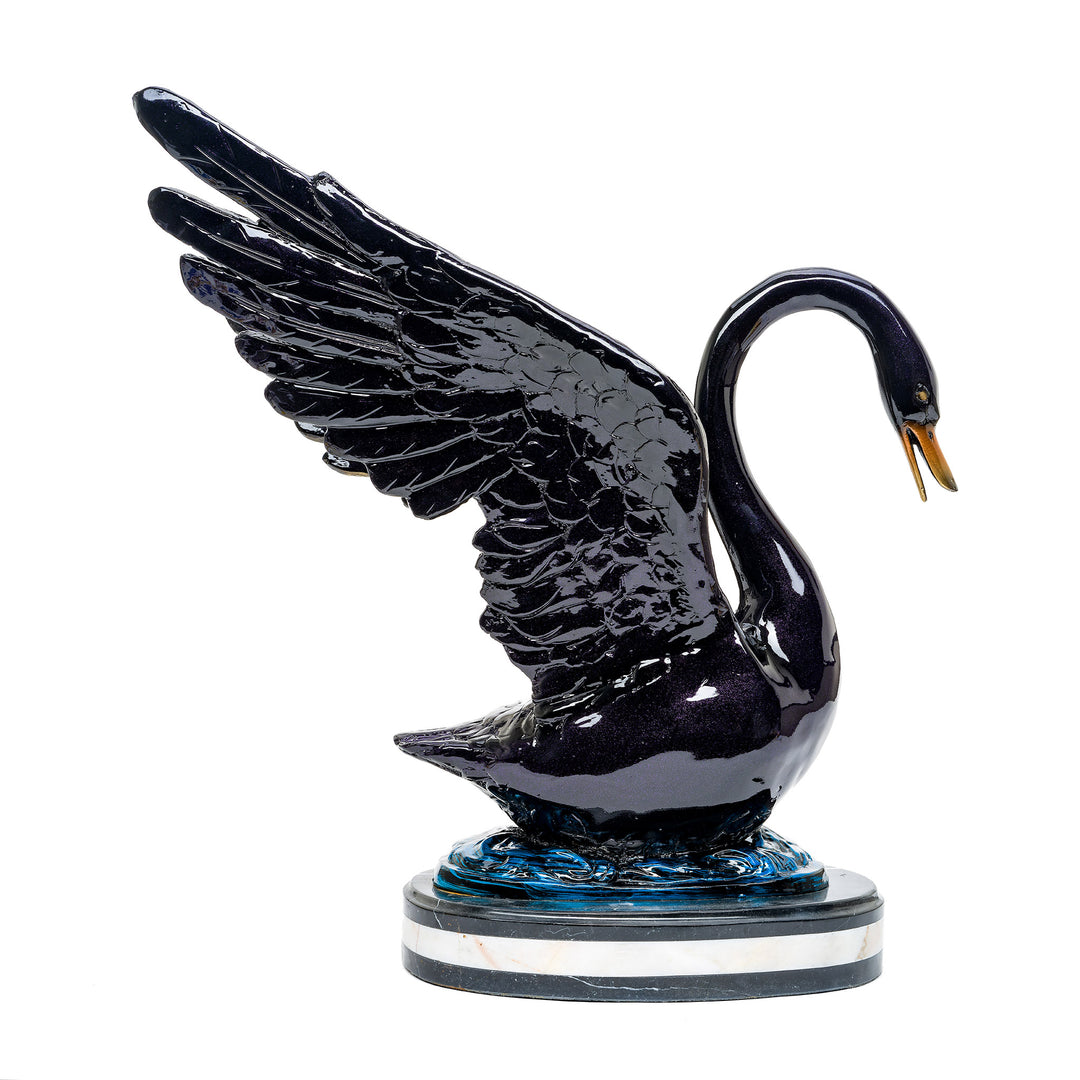 Detailed bronze swan sculpture showcasing dynamic pose and patina.