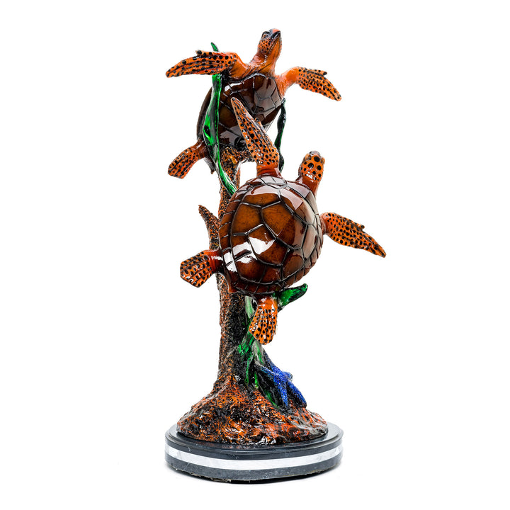 Detailed marine life sculpture featuring bronze turtles and colorful fish.