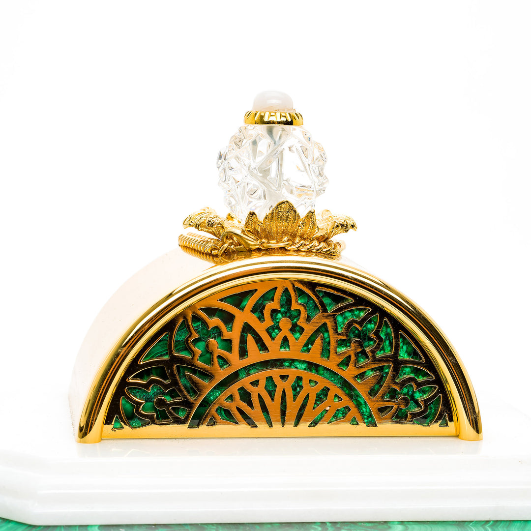 Detailed view of the gold scrollwork on the Archimede Malachite Clock.