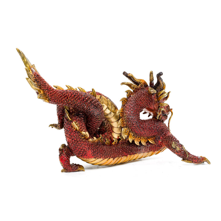Detailed view of the scales and claws on the red bronze dragon.