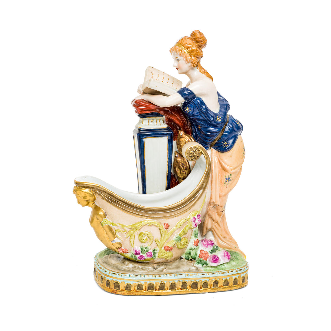 Dresden Porcelain Reading Lady figurine with floral vessel.
