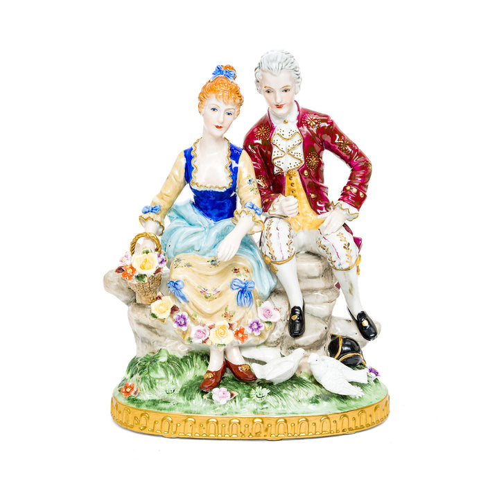 Dresden Porcelain Seated Couple in a flower garden.