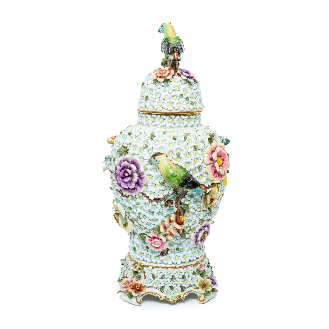 Elegant Capodimonte vase adorned with lifelike floral motifs.
