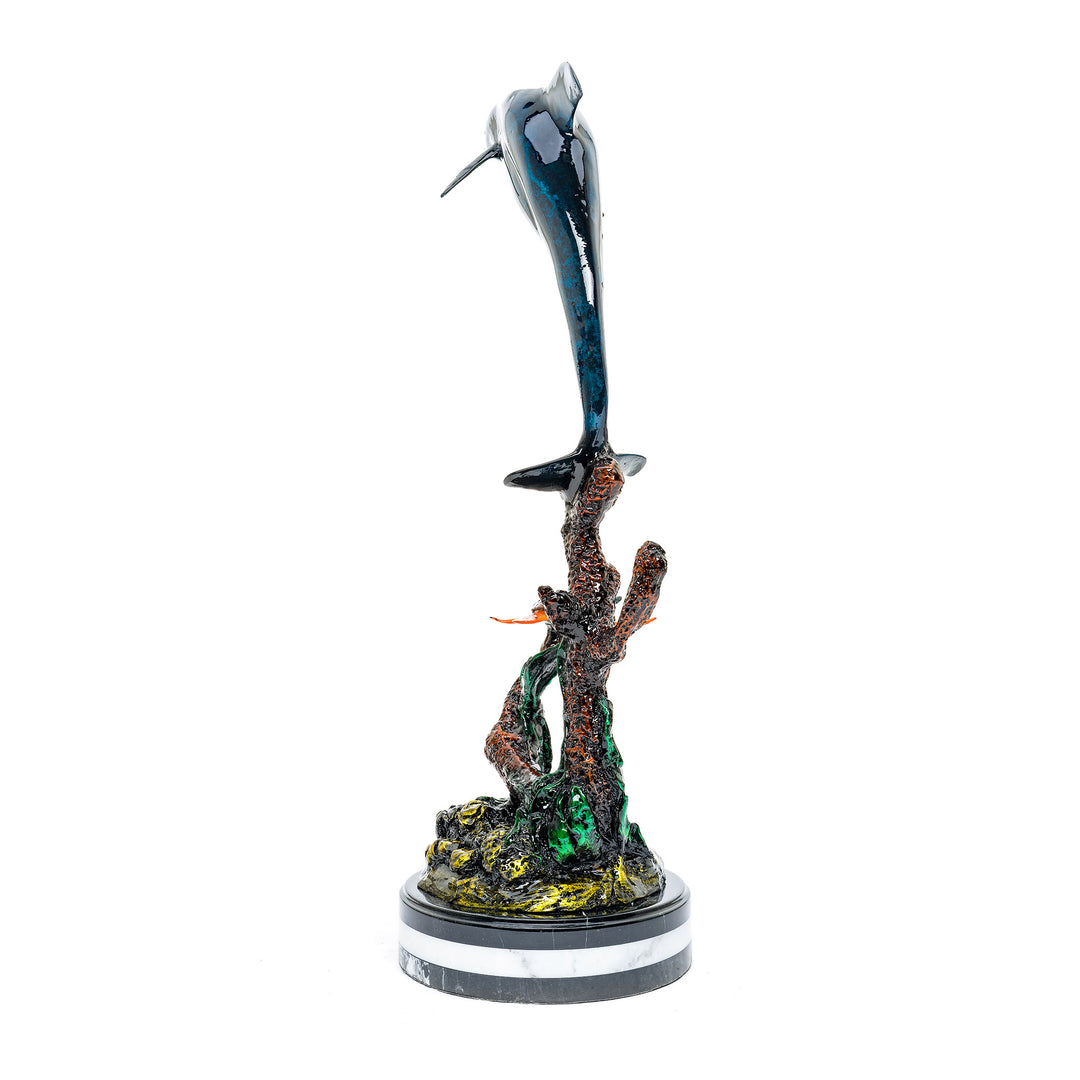 Elegant bronze dolphin leaping above a turtle, set on a marble base.