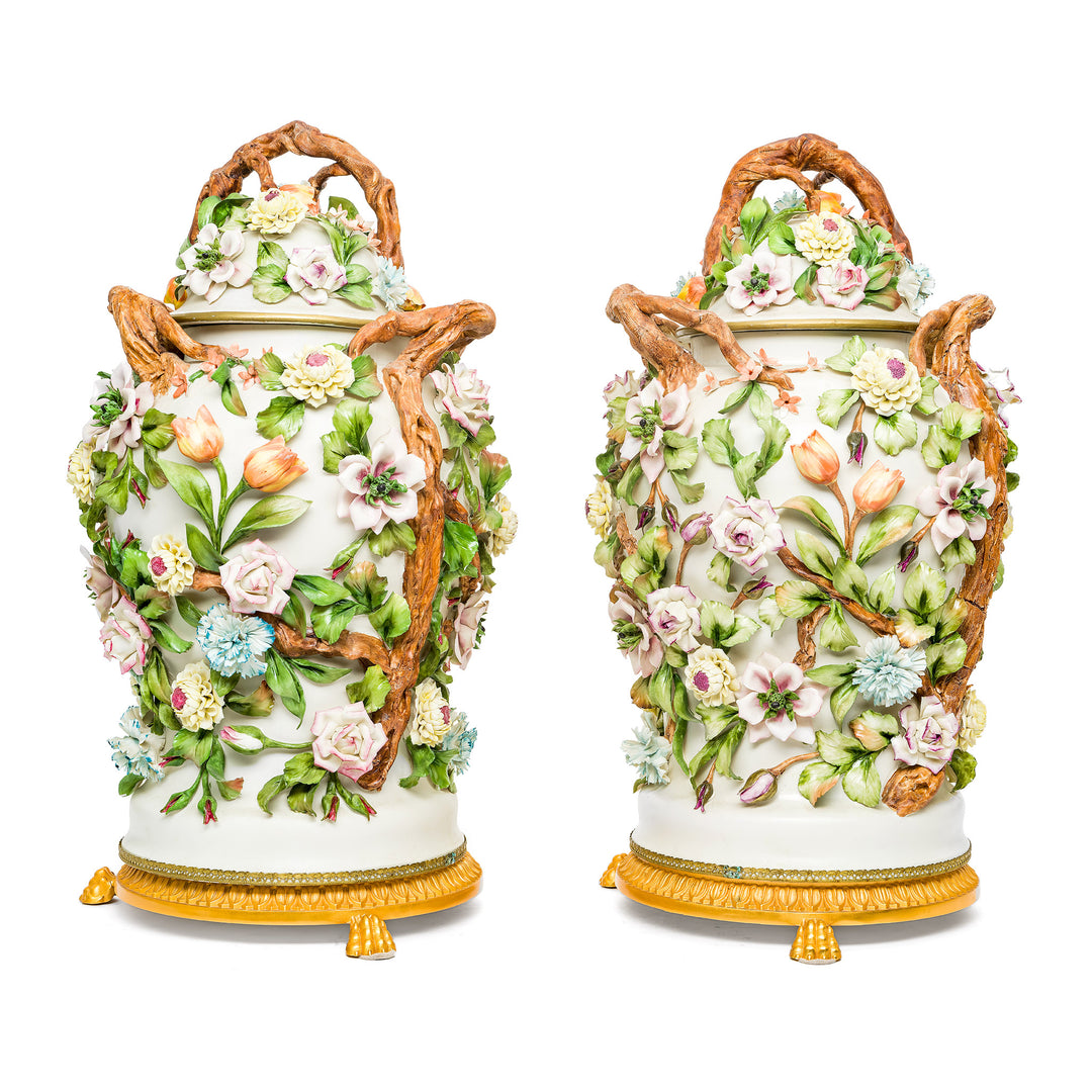 Exquisite Capodimonte porcelain vases with hand-sculpted flowers.