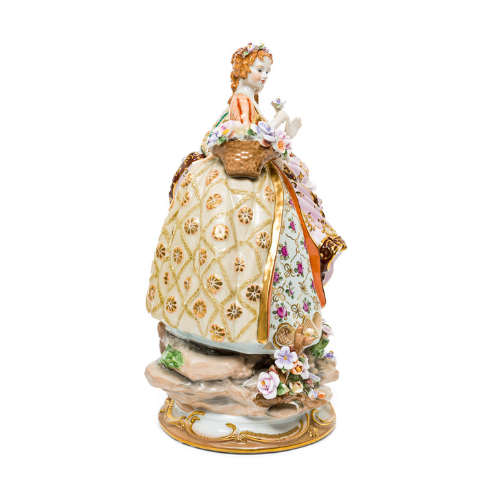 Exquisite Dresden figurine with delicate floral accents.